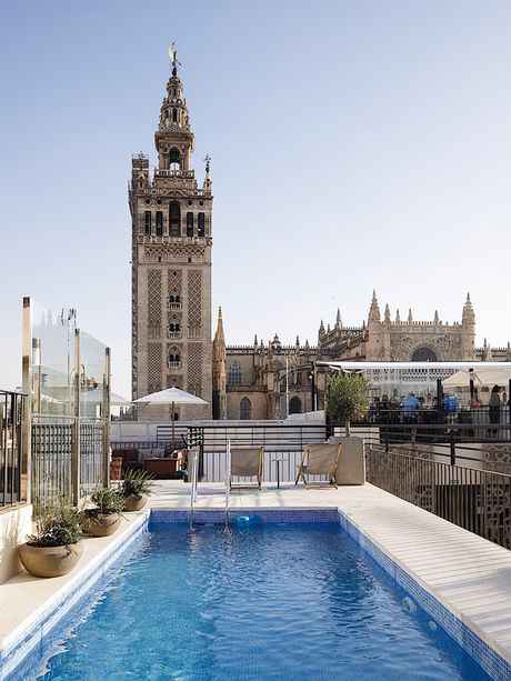 Pool at the EME Catedral Mercer Hotel with views of the Seville Cathedral