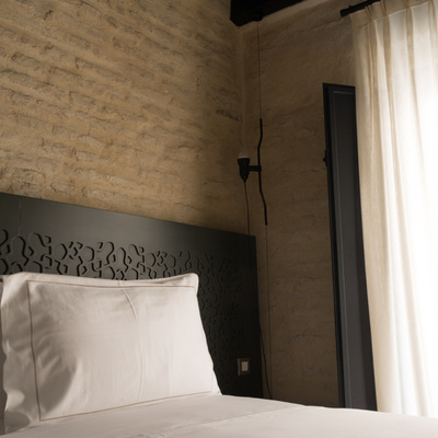 Bed of the Standard Room at the EME Catedral Mercer Hotel